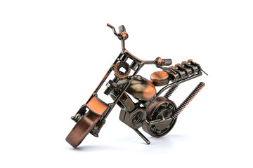 Hand craft of Motorcycle model made by scrap metal pieces isolated on white background. (Image Stacking Technique)