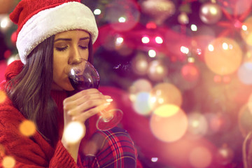 Happy holiday.woman drinking red wine