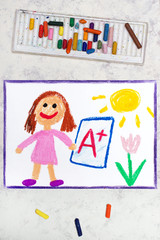 Obraz na płótnie Canvas School grades. Happy student with exam or test result.Girl holding report card with A+ grade. Photo of colorful hand drawing.
