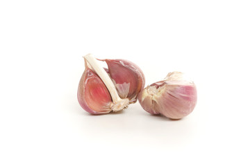 many garlic cloves on a white background