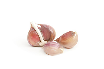 many garlic cloves on a white background
