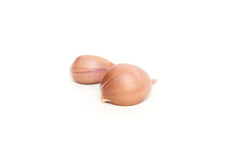 many garlic cloves on a white background