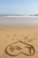  heart painted on beach sand