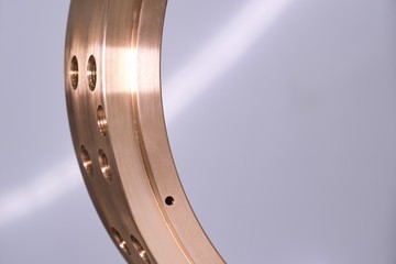 Precisely manufactured bronze product, machining and metal dimension measurement.