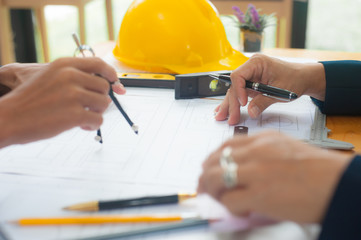 Architects collaborate to design construction projects.