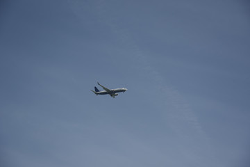 Fototapeta na wymiar Flying Airplane in the Sky