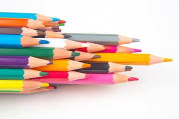 Colored pencils for drawing on a white background. Education and creativity. Leisure and art
