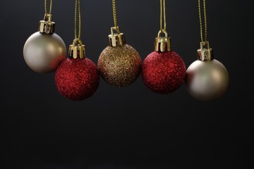 Gold and red christmas decoration ball on black background