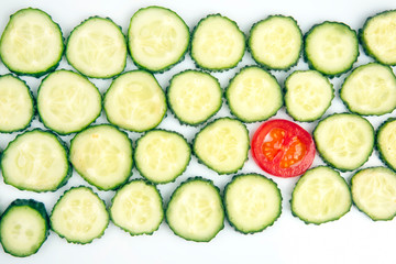 sliced ​​pieces of cucumber and tomato on a white background. fast food and breakfast