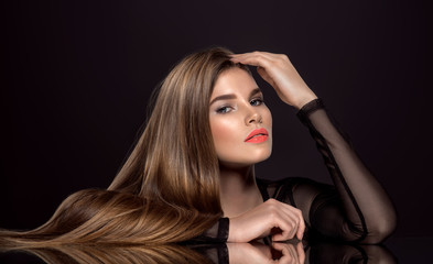Woman with beauty long brown hair. Beauty woman with living coral color lipstick on lips.