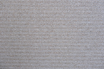 Cross section of thin fiberboard in a stack as a background, texture