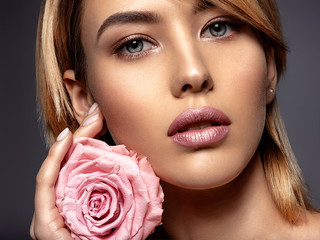 Fototapeta na wymiar Beautiful young fashion woman with light pink lipstick. Beauty model.