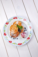 pancakes with ice cream and blueberries