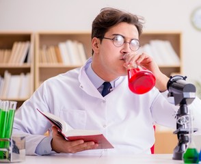 Mad crazy scientist doctor doing experiments in a laboratory