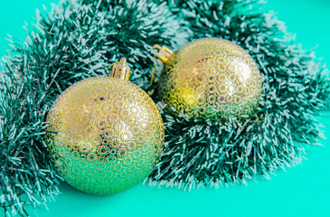 Christmas aqua background with gold balls. New year party decoration. Copy space.