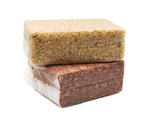 Organic Brown rice and rice berry in vacuum package bag isolated on white background ,export agriculture product and packaging concept