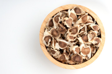 Moringa Oleifera seed dried on isolated white background.