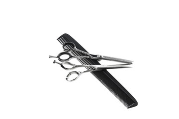 Obraz premium Two hairdressing scissors and a comb on a white background