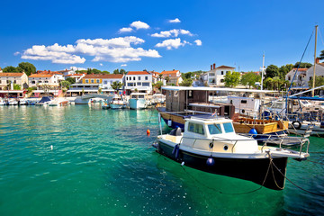 Krk island. Town of Njivice turquoise harbor and waterfront