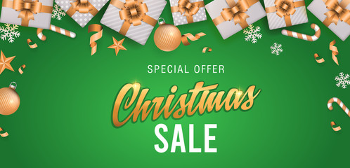 Christmas sale green background banner or web header with glitter elements, snowflakes, gift boxes and calligraphy
