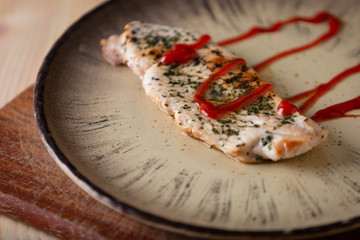 Turkey steak on a wooden table. Country style.