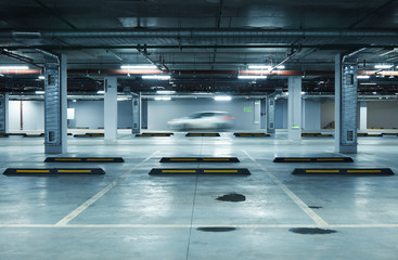 Horizontal image of empty underground parking lot