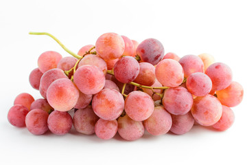 One bunch of ripe organic pink grapes isolated on white background, side view