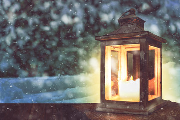 Christmas lantern on wooden table and landscape of winter night. Space for text.