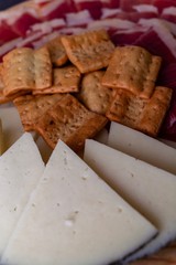 Wood plate with freshly jamon, cheese and roasted bread. Healthy food. Spanish food.