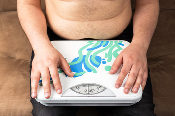 Portrait of sad obese man holding a weight scale, thinking about his weight problem