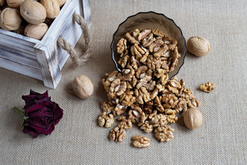 shelled walnuts scattered from the bowl