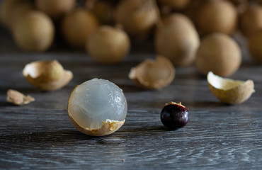 Pile of Longan fruit fresh on wooden gray floor, thai fruit