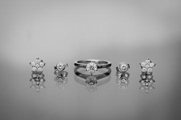 Engagement ring and ear rings close up