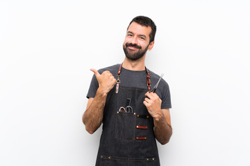 Barber man in an apron with thumbs up gesture and smiling