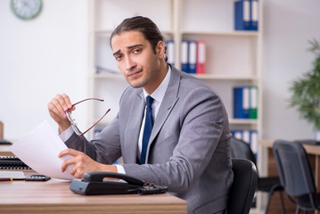 Unhappy male businessman in the office