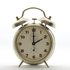 Old-style alarm clock, metal, it's two o'clock.