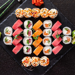 fresh and tasty sushi on the black background