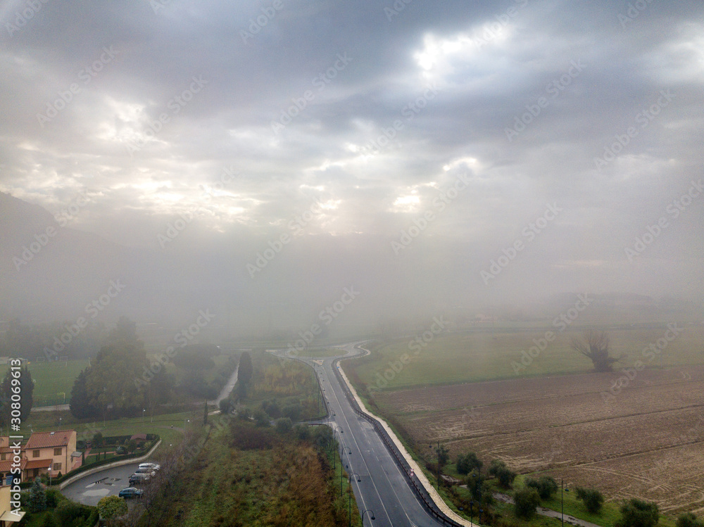 Canvas Prints Aerial view street in the fog, Tuscany