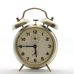 Old-style alarm clock, metal, it's quarter to six.