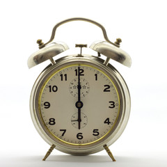 Old-style alarm clock, metal, it's six o'clock.