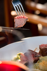 a piece of steak on a fork
