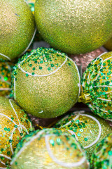 Christmas decorations in boxes. Balls for the Christmas tree of green light. Christmas preparation concept. Christmas background for cards and congratulations. vertical photo