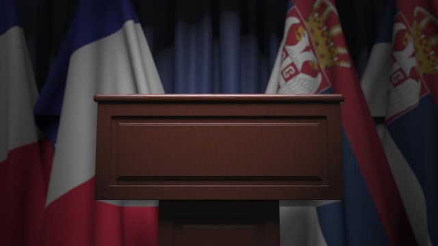 Many flags of Serbia and France behind speaker tribune, 3D animation