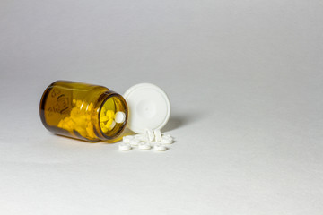Jars of pills on a white background