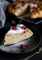 Apple pie with suger powder at dark background