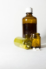 Jars of pills on a white background