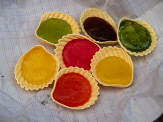 multicolored candies on a school notebook sheet
