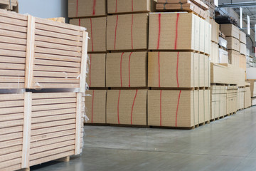 Warehouse tree. Pallets with wooden plates in a warehouse or in a hangar. Lumber production