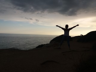 silhouette of man on top of mountain