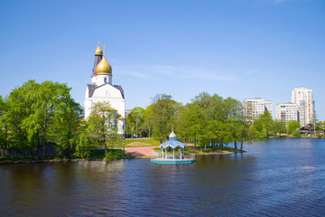 The old Church of the Holy Apostles Peter and Paul on the banks of Razliv lake  on a sunny May day....